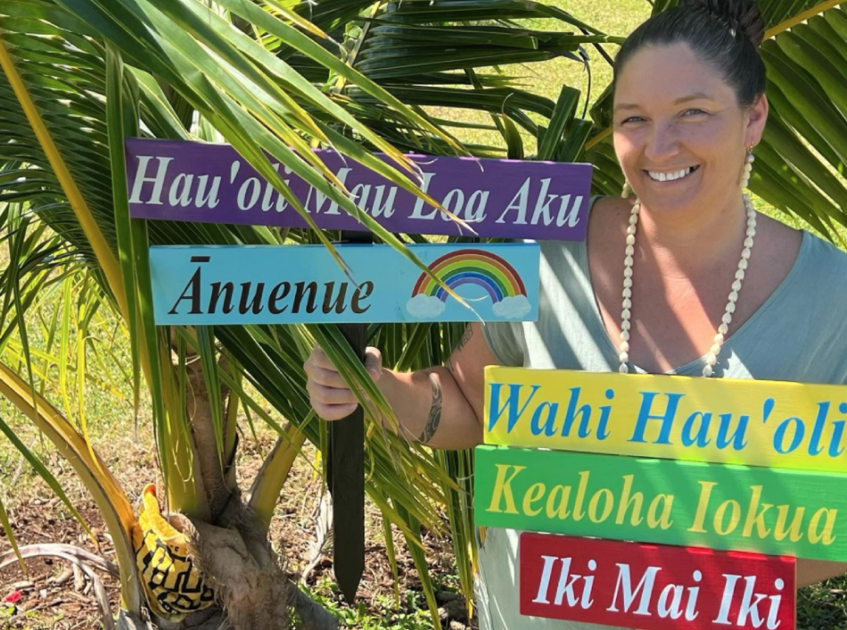 Staff Holding Hawaiian Language Signs